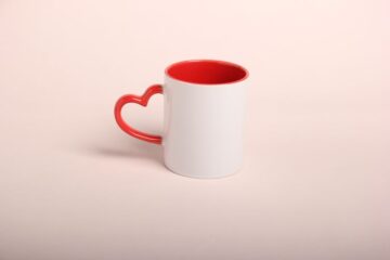 Coffee mug with a heart handle
